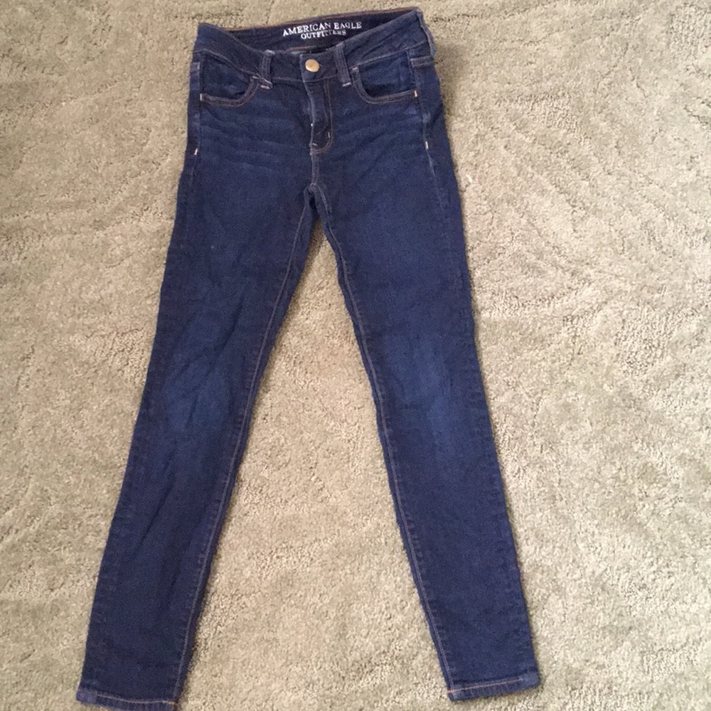 dark wash blue jeans.